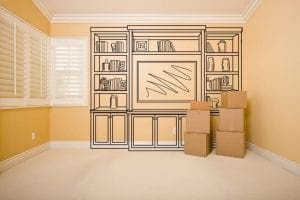 Moving Boxes in Empty Room with Shelf Design Drawing on the Wall.