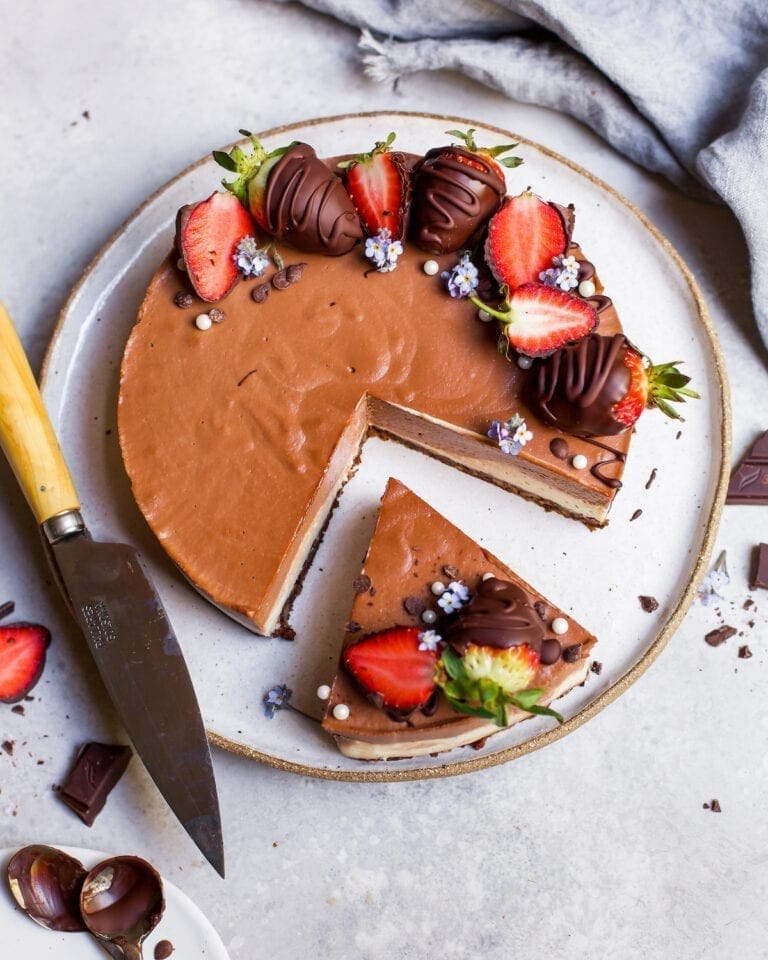 triple chocolate mousse cake with chocolate covered strawberries