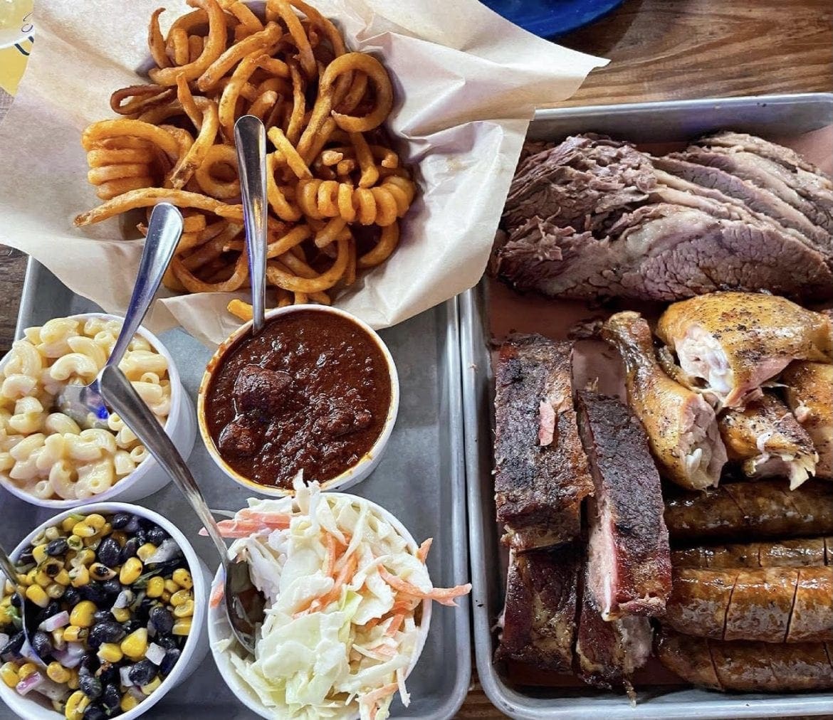 Combo platter with sides and curly fries from House of ‘Que in Hoboken, NJ