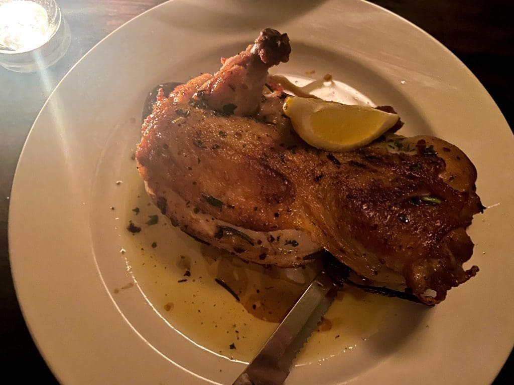 Roast half-chicken with lemon and cippolini onions at Zeppoli Collingswood