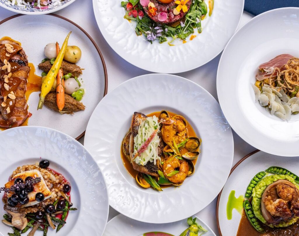A spread of elegantly plated dishes at one of the best restaurants in Jersey City