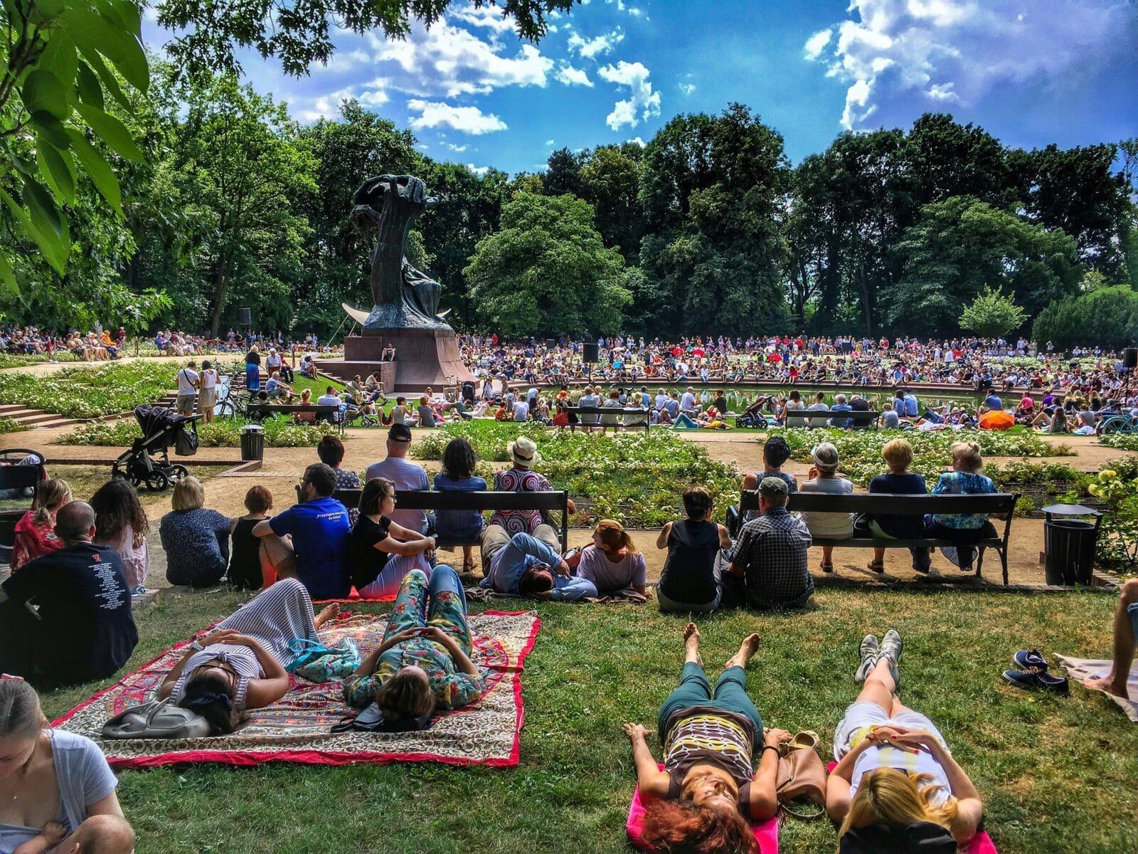 a crowd of people sitting on the floor