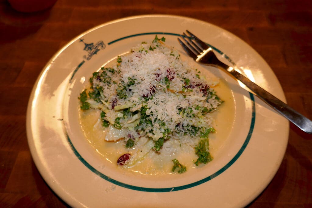 Kale and cabbage salad with pear and dried cranberries