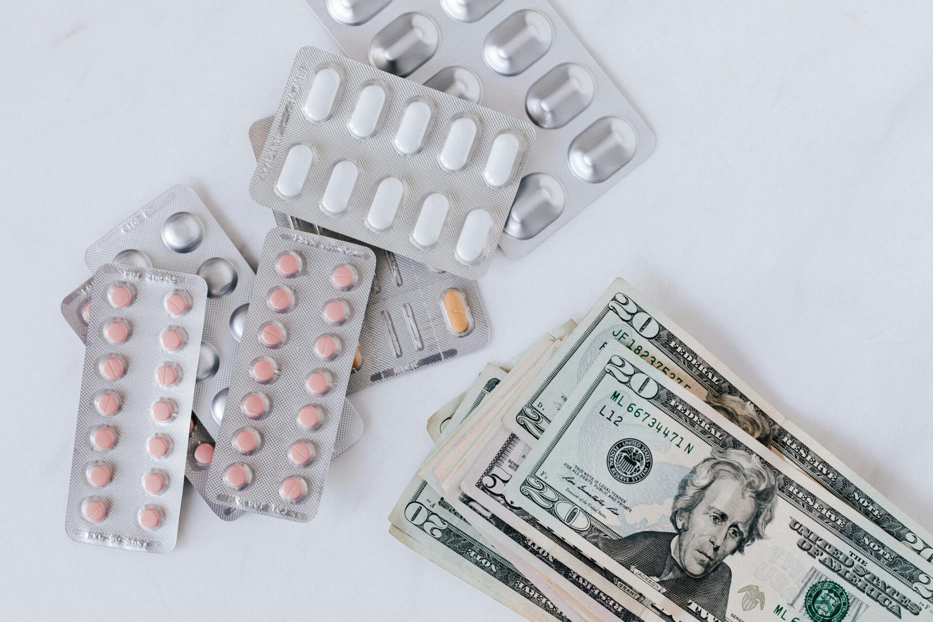 Medical debt. Pills and money pictured.