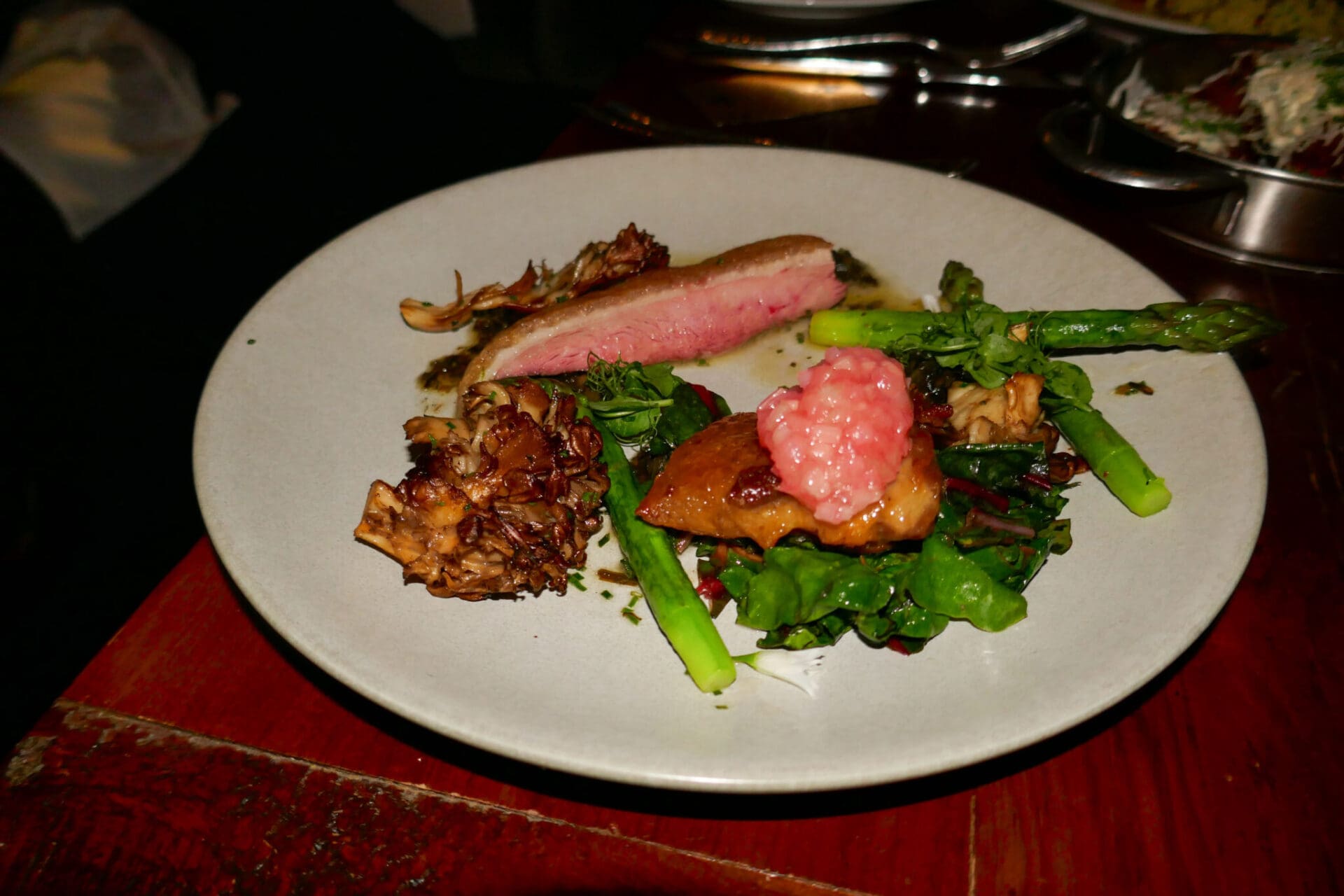 Honey-Lacquered duck surrounded by a bounty of spring flavors