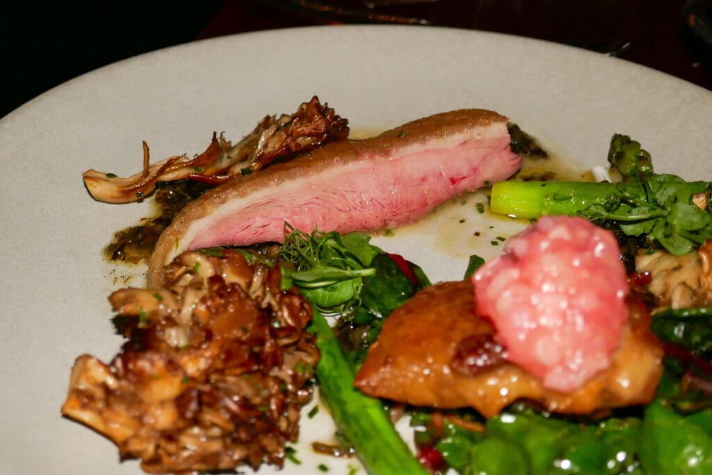 Honey-lacquered duck with rhubarb, asparagus, wilted chard and crispy mushroom