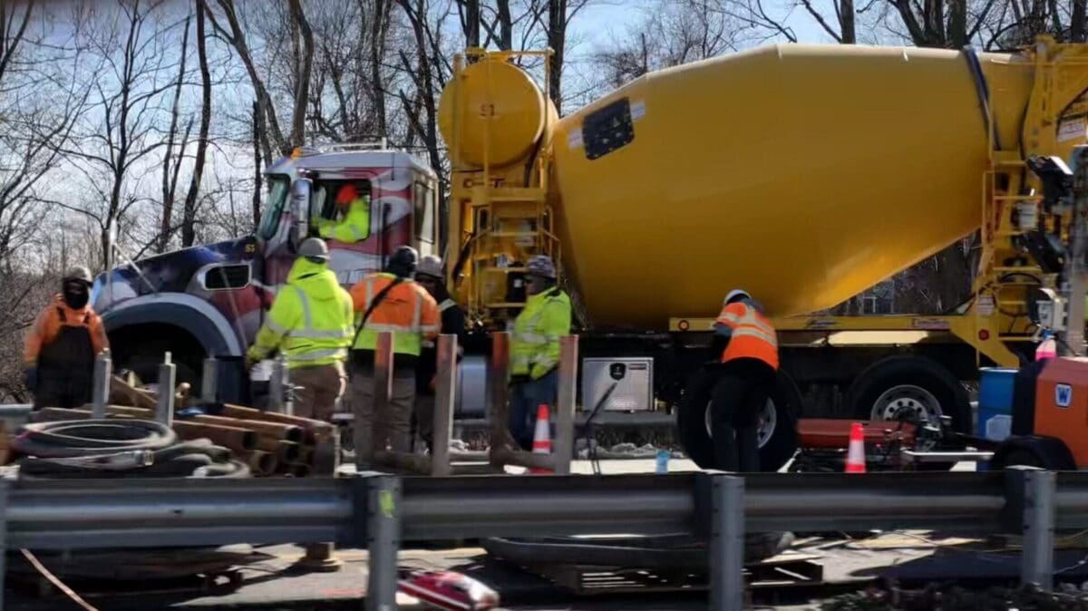 repair crew with a concrete truck