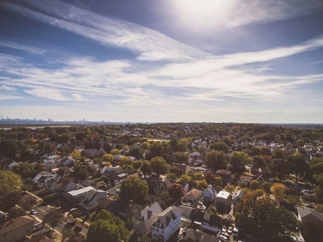 aerial view of NJ suburbs with NYC in background - New Jersey best places to live