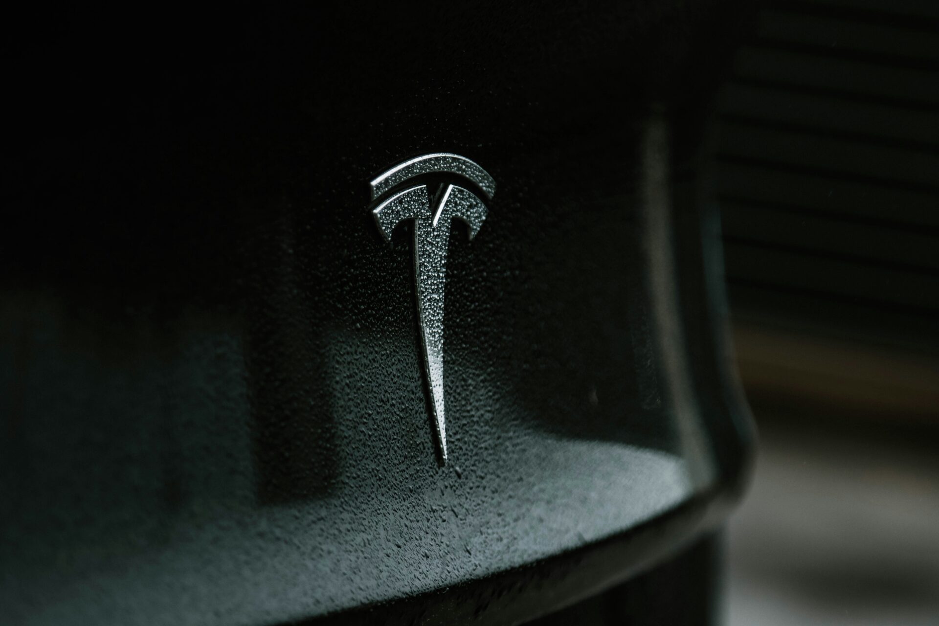 Tesla logo on the back of a car