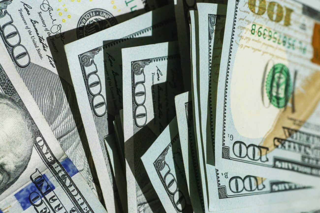 pile of 100 dollar bills