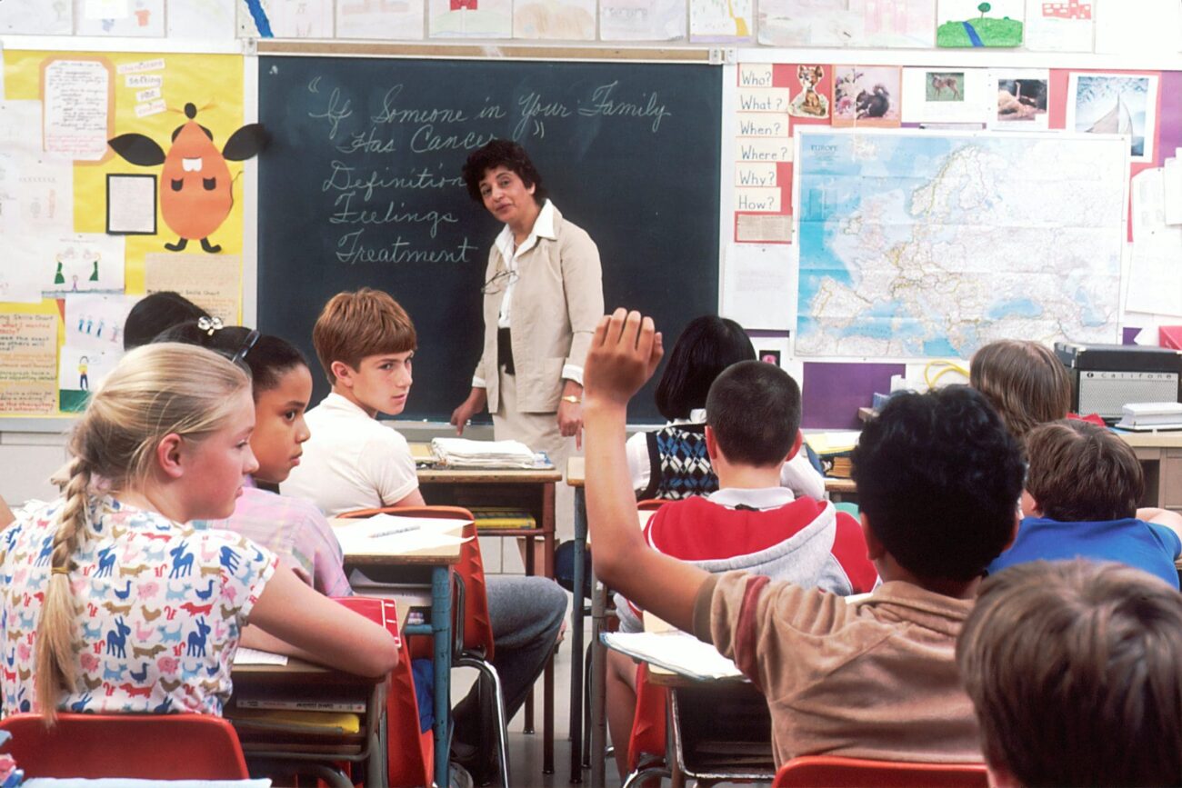 classroom full of students, NJ school district considering later start times