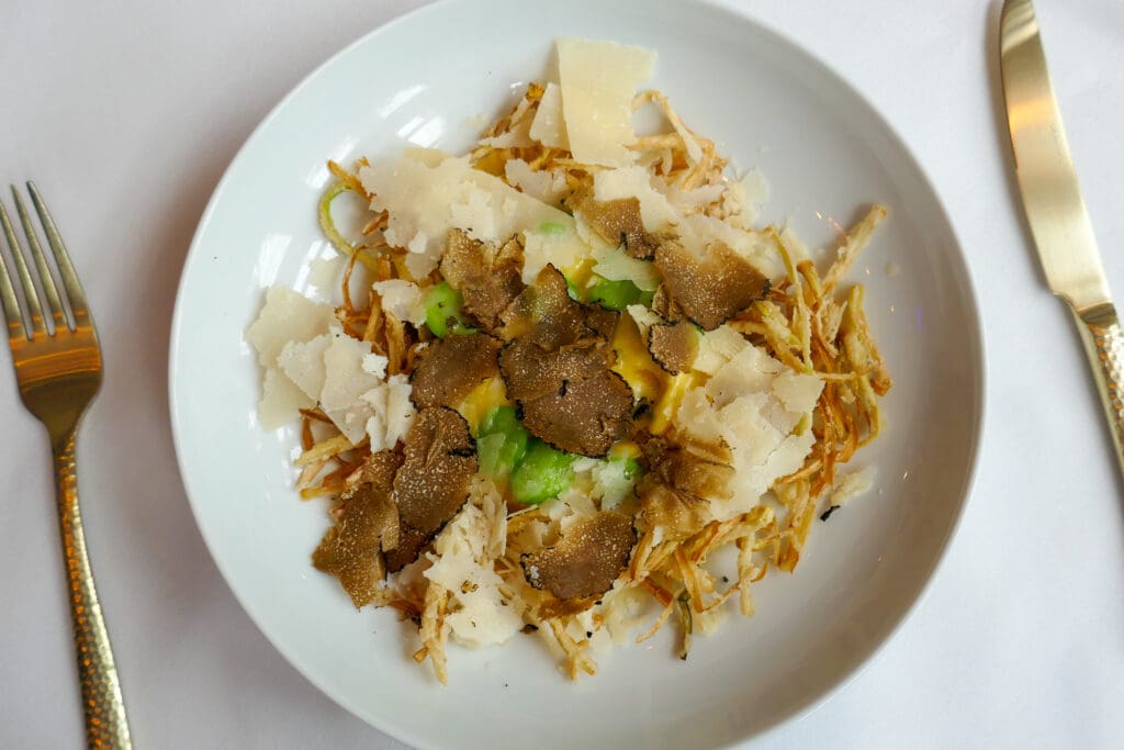 The Ox and Egg features an egg yolk-stuffed raviolo, braised oxtail and plenty of black truffle