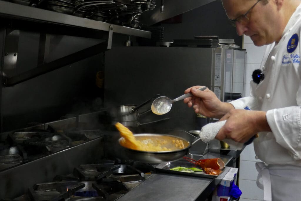 Jersey City fine dining - Chef Brian Walter finishes a lobster risotto