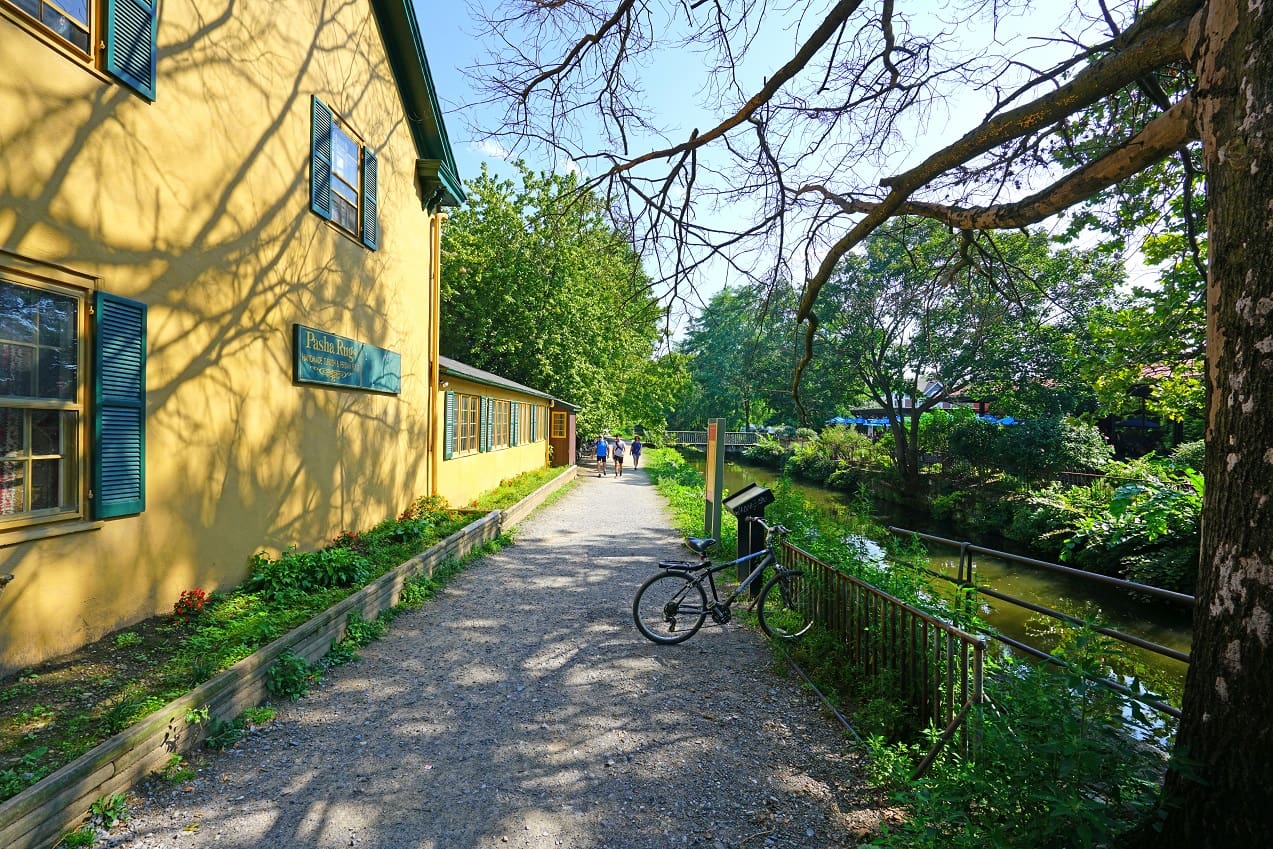 Street view in Lambertville NJ with greenery and a river in background.