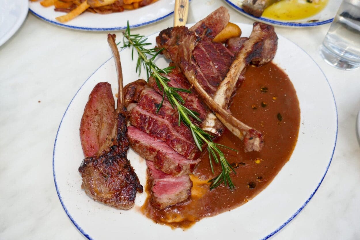 The famous mixed grill, with dry-aged NY Strip, lamb chops and sausage