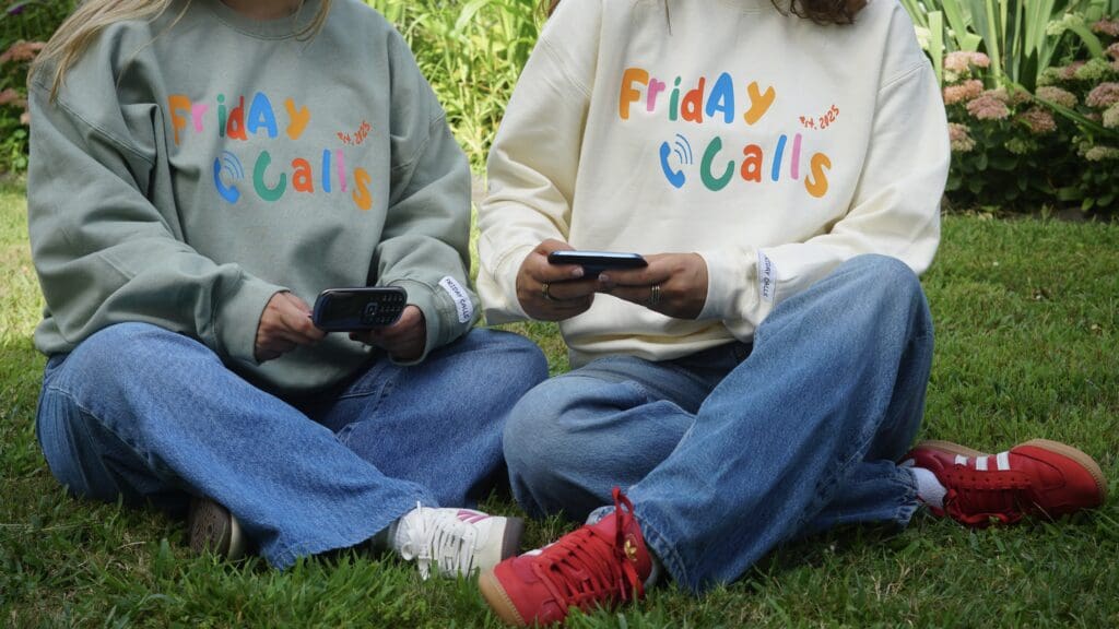 two girls model Friday Calls crewnecks