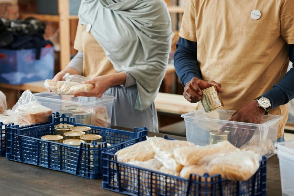 Volunteers sorting food donations at a food bank