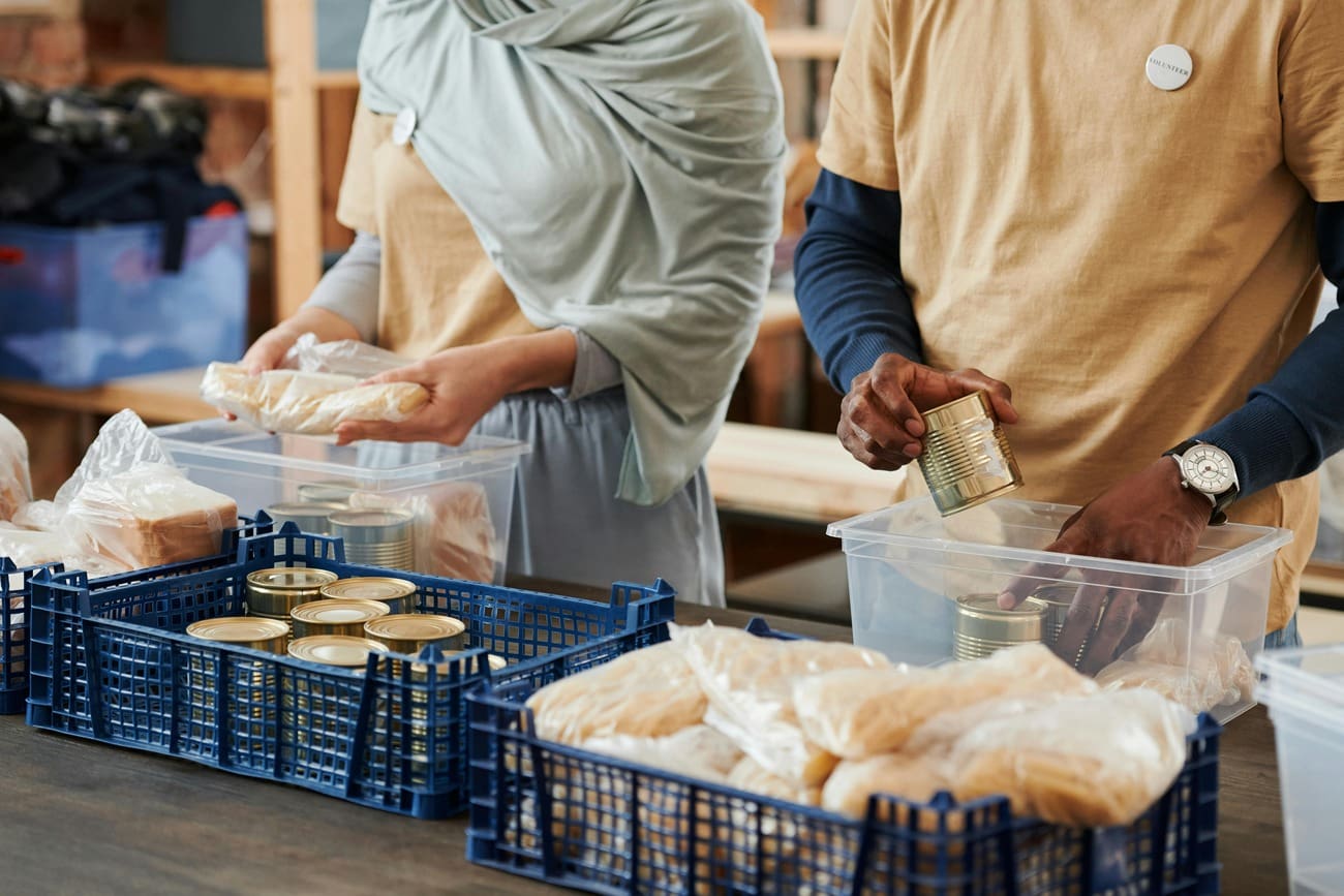 Volunteers sorting food donations at a food bank