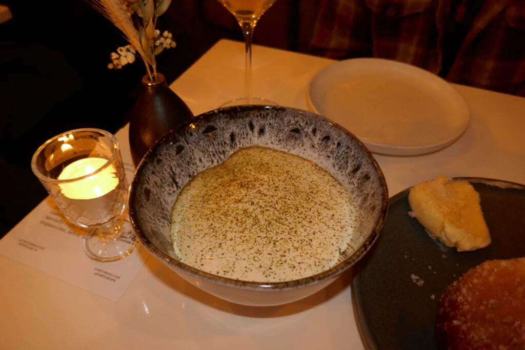Charred leeks hide underneath a blanket of horseradish foam