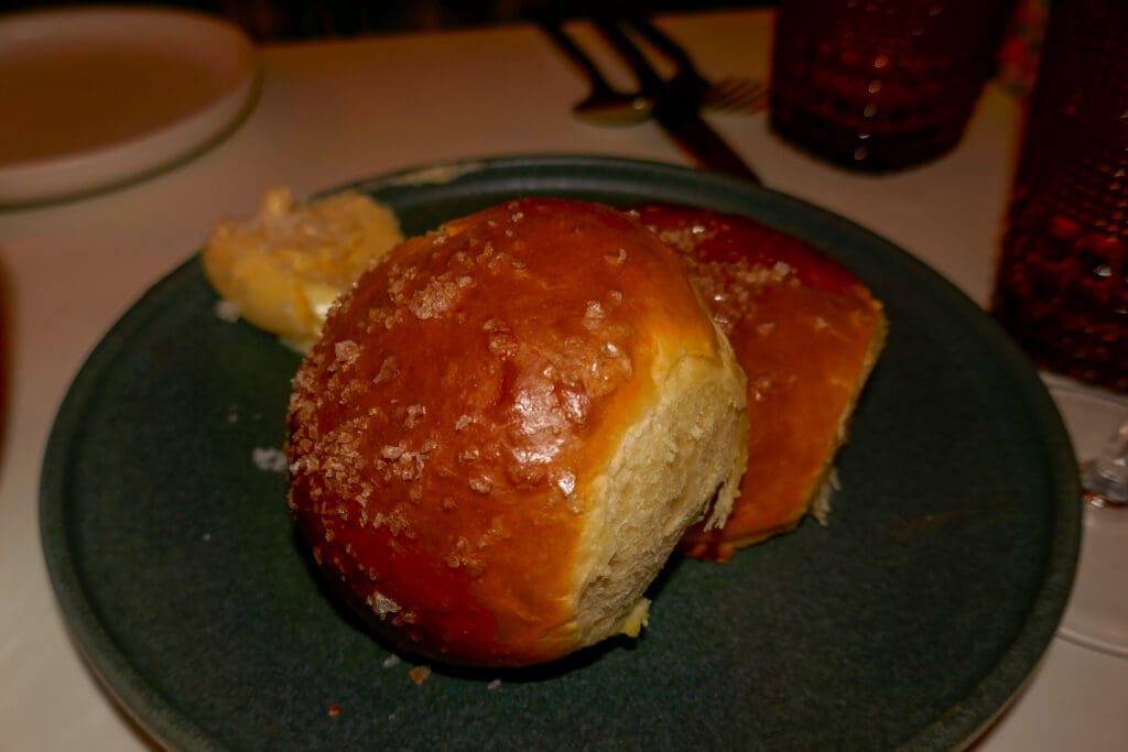 Fresh dinner rolls with honey butter