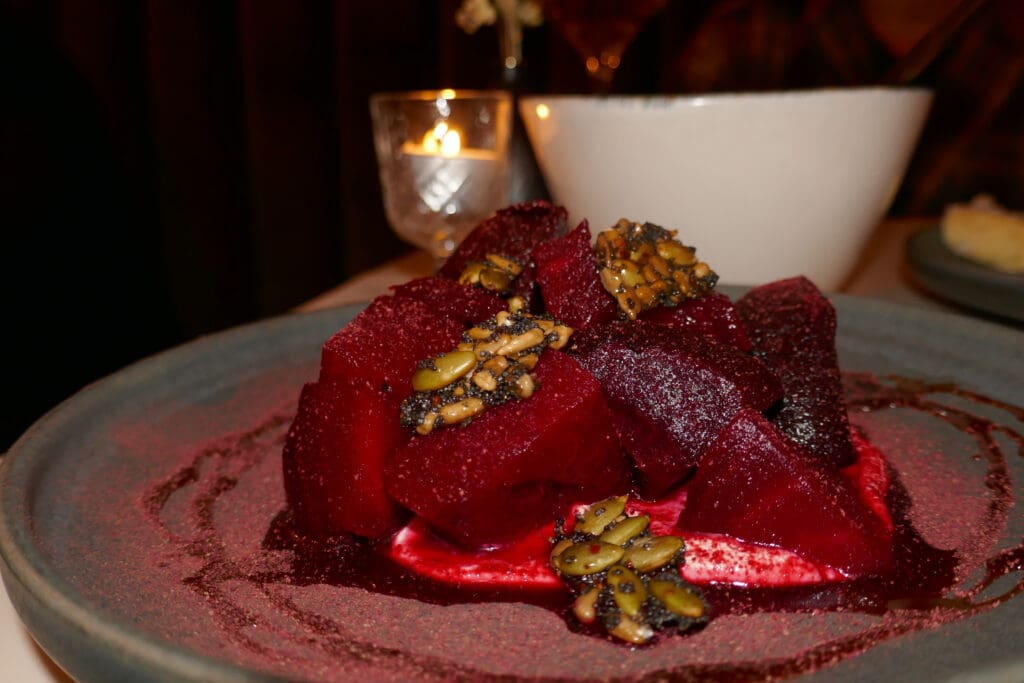 Salt-roasted beets served with labneh and seed brittle