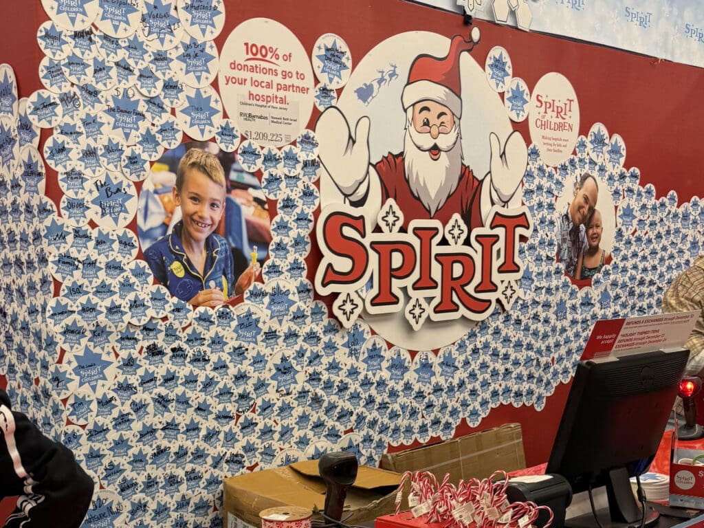 wall covered in paper snowflakes representing donations