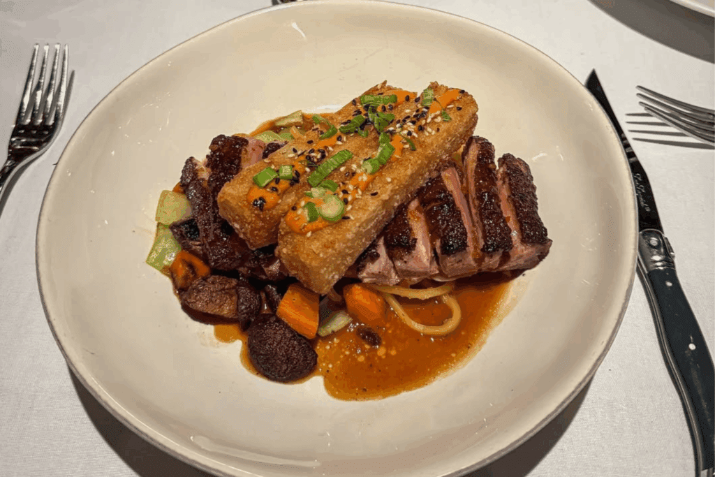 Pan-roasted duck breast at The Saddle River Inn, top 100 restaurant in US by OpenTable