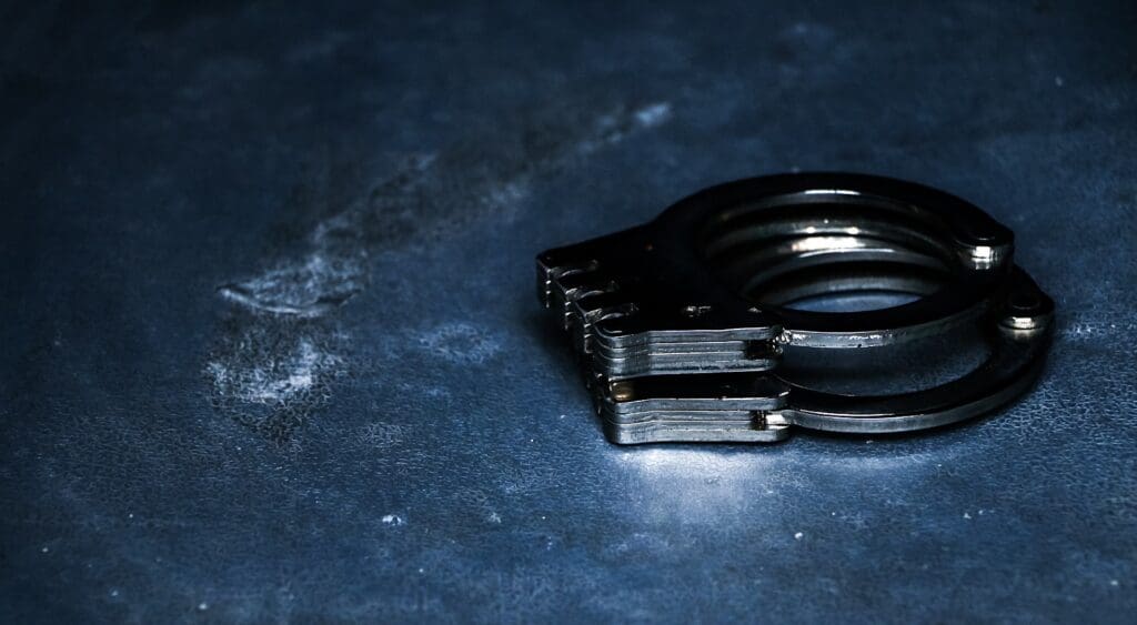 Handcuffs symbolize NJ college athletes charged in illegal betting ring