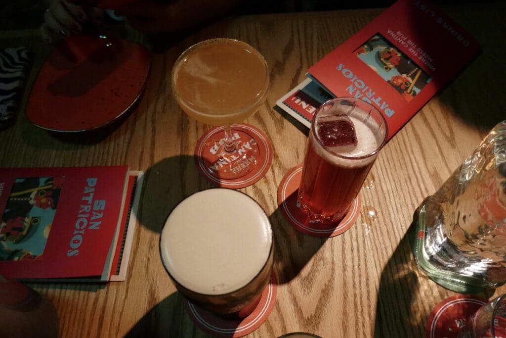 a trio of drinks at San Patricios: 2 cocktails, including The Countess and a pint of Guinness