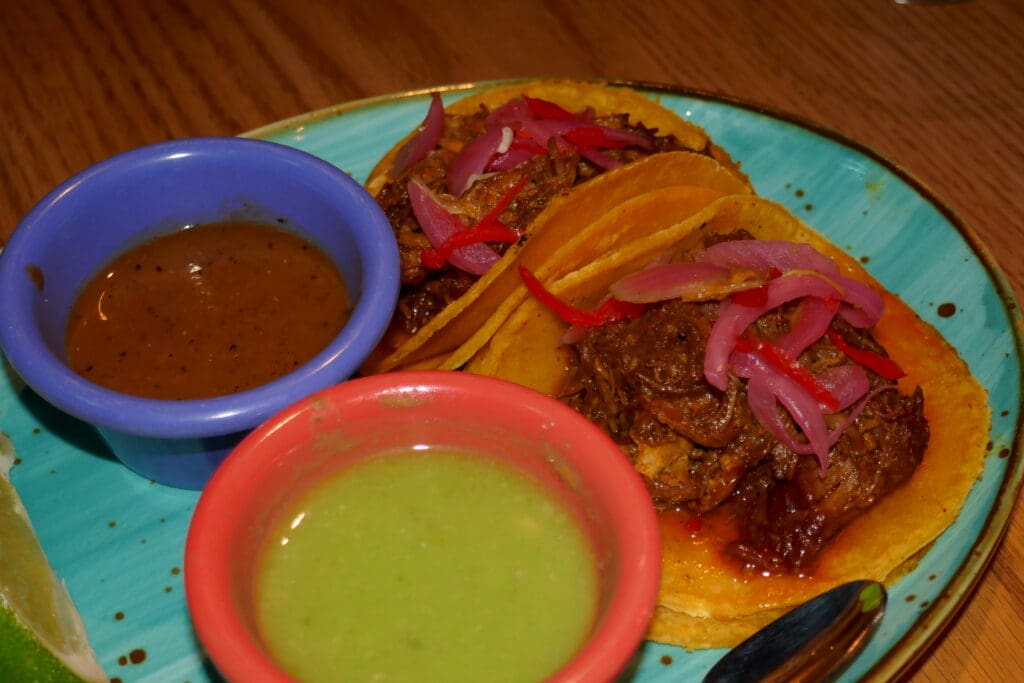 Slow-roasted pork pibil, stuffed into hand-made corn tortillas