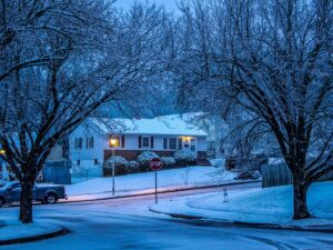 Early morning on a New Jersey road with light snow and wet pavement