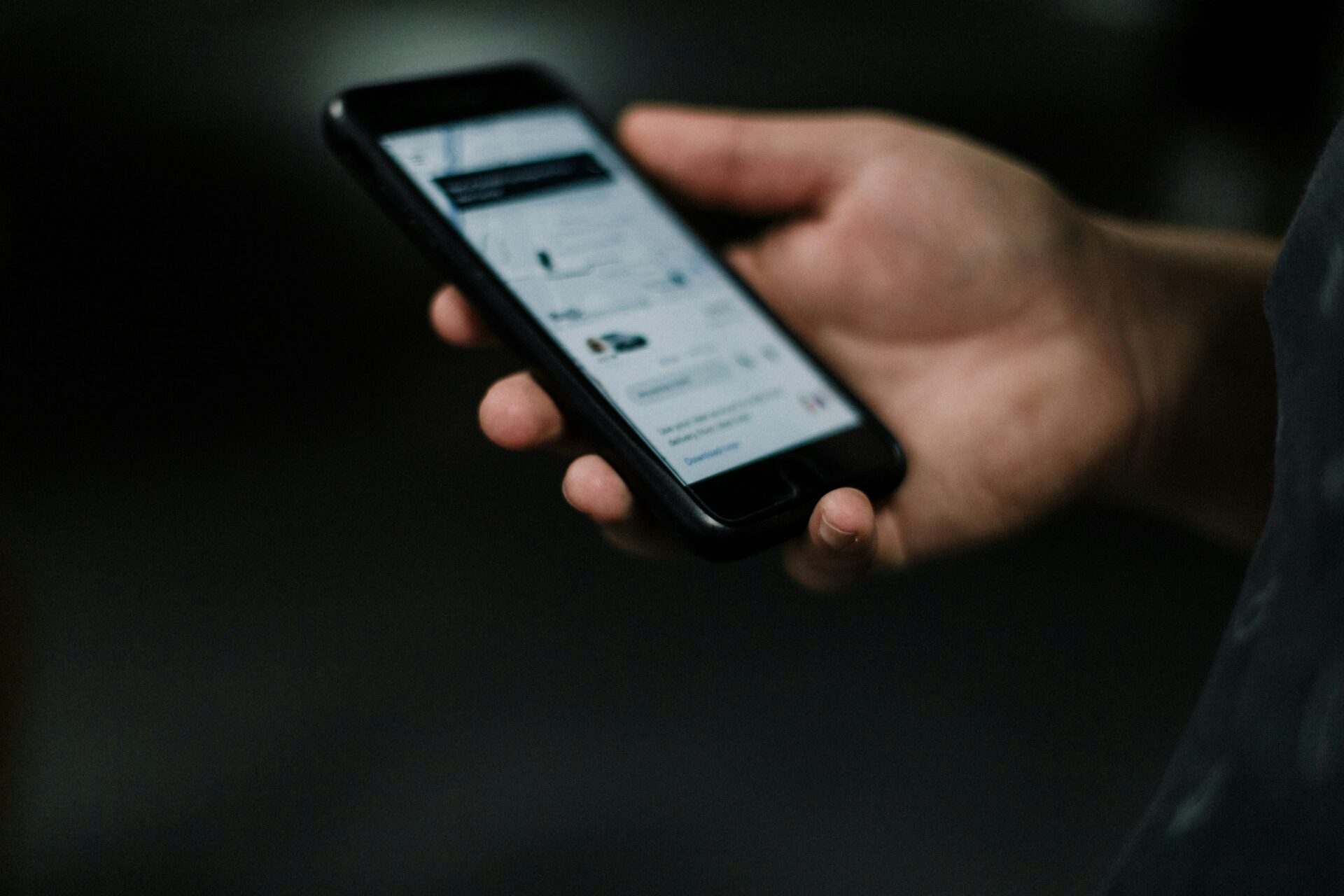 Uber logo displayed on a smartphone as New Jersey joins a lawsuit over Uber One subscription practices