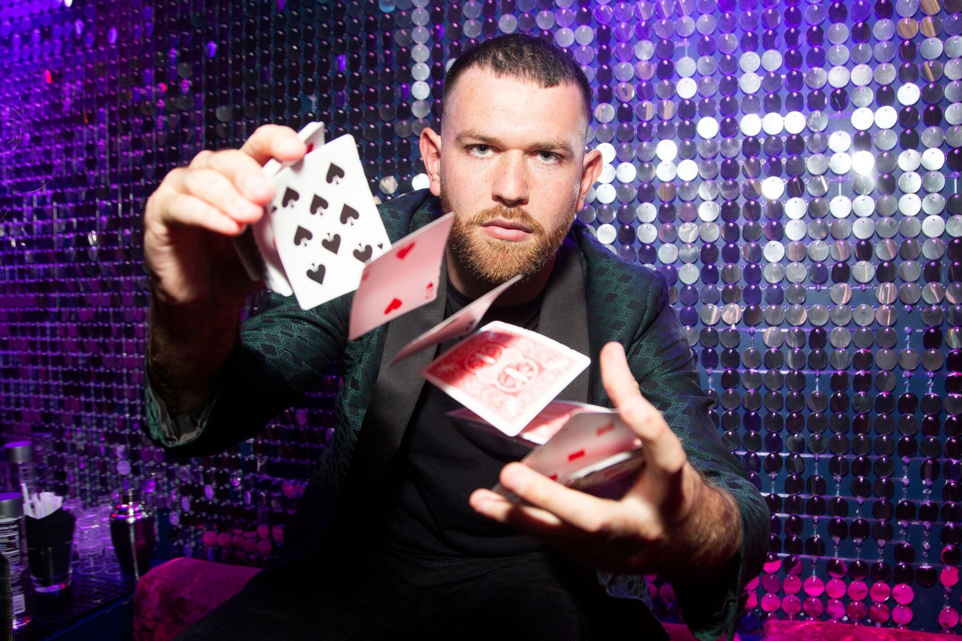Josh Pele performing a card trick