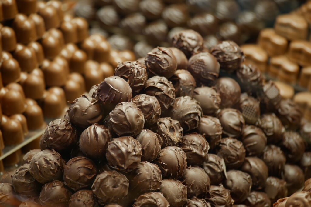 pile of chocolate truffles and other assorted candies