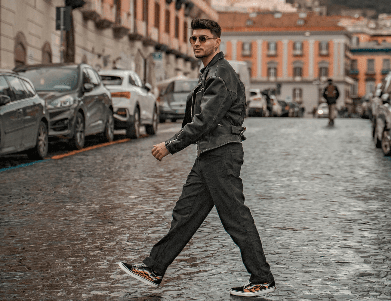 Man crosses street wearing Jacket Maker