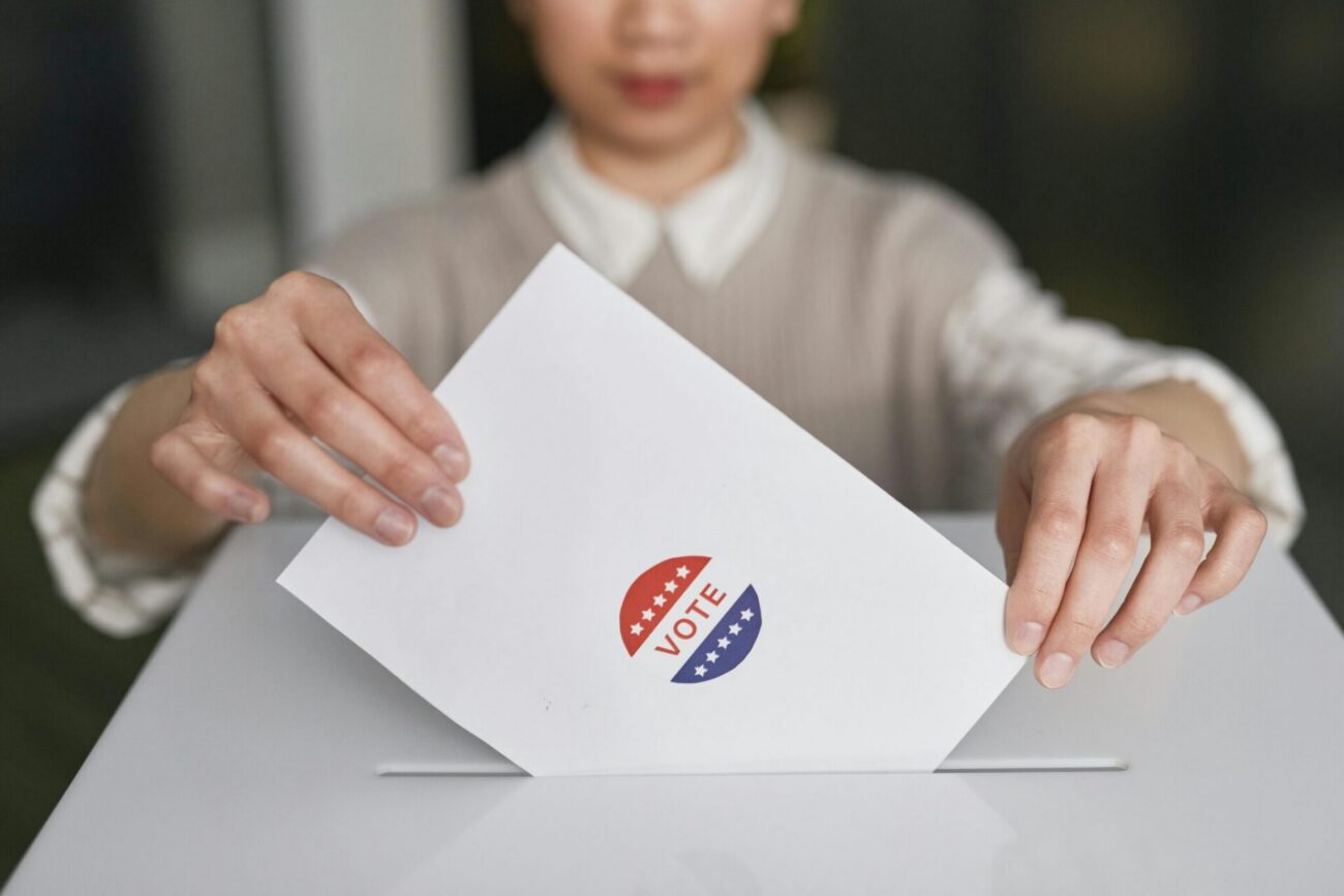 woman casts ballot in election
