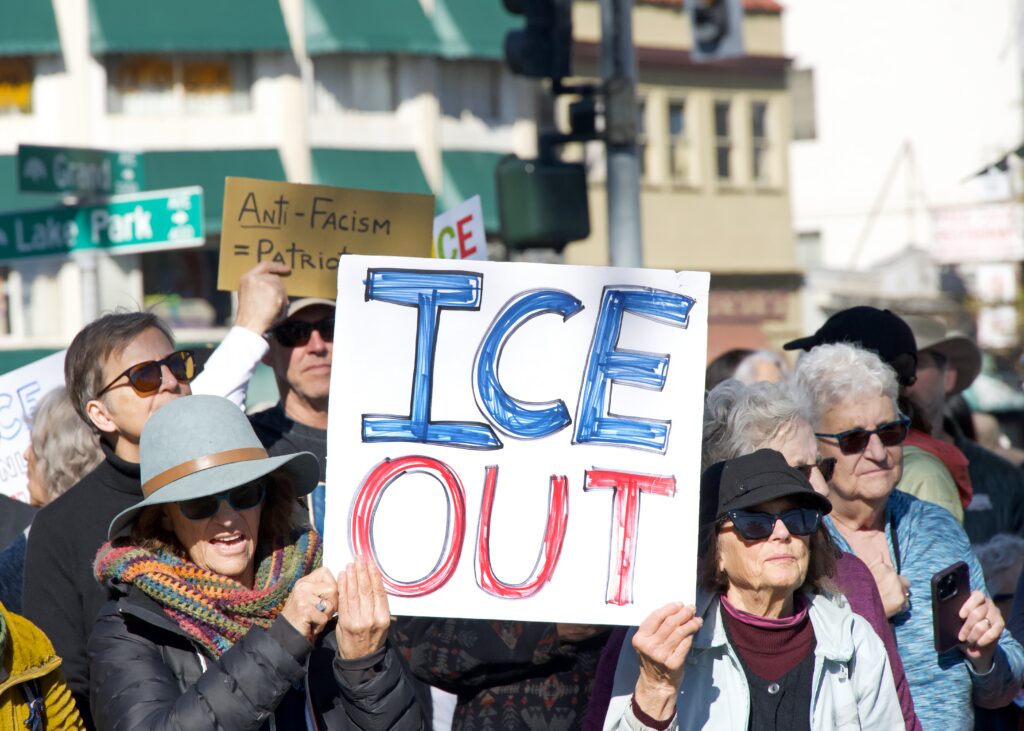 "ICE OUT" on protestor signs
