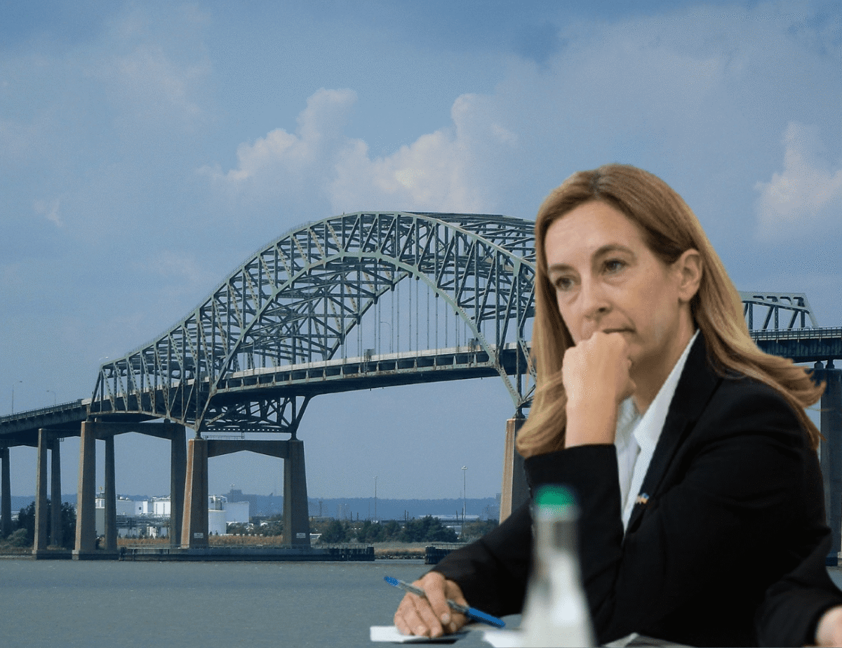 Governor Mikie Sherrill announces scaled-back Turnpike expansion plan, with Newark Bay bridge visible in background