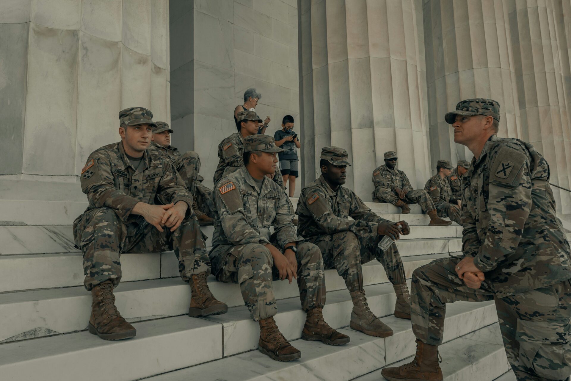 U.S. military personnel in camouflage uniform; New Jersey lawmakers debate military authorization for Iran strikes