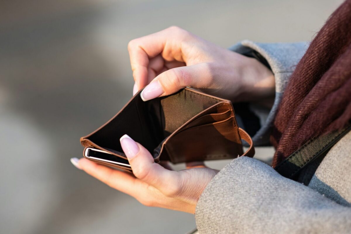 Person holding empty wallet as New Jersey cost of living rises, making it harder to afford housing, food, and utilities in 2026