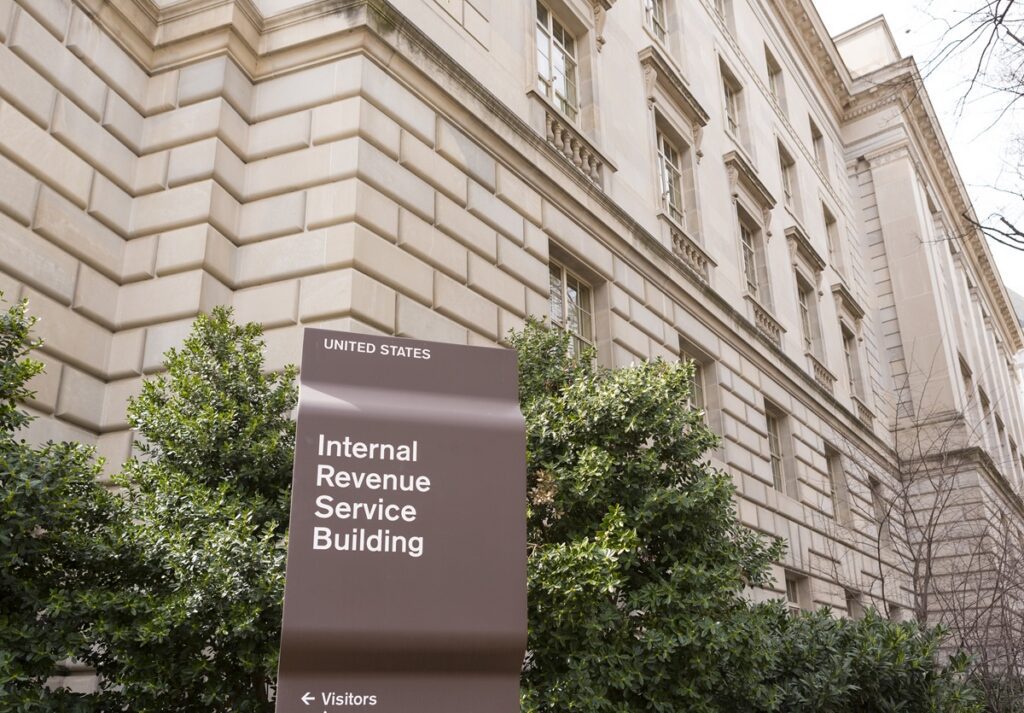 Internal Revenue Service building sign as taxpayers face refund delays during IRS transition away from paper checks
