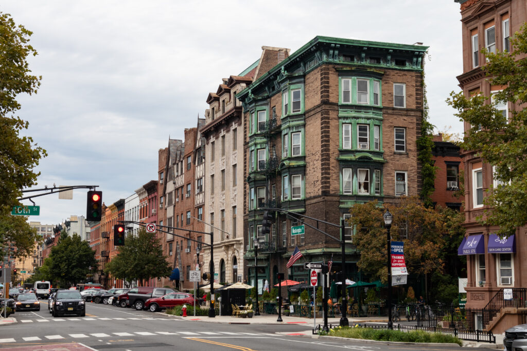 Hoboken, New Jersey street with historic apartment buildings as algorithm-based price-fixing drives rent increases up to 61% in urban areas