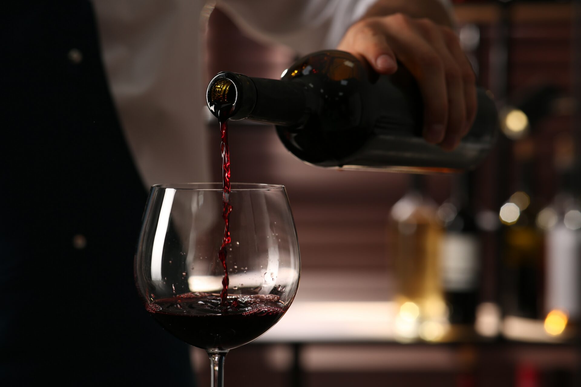 Red wine being poured at Groth Vineyards dinner at Jersey City's 87 Sussex restaurant