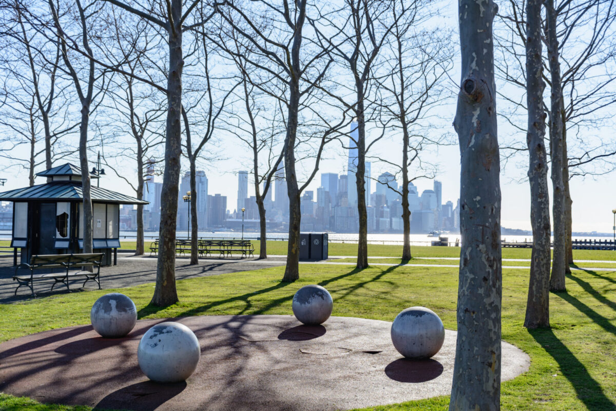 Liberty State Park in Jersey City with Manhattan skyline view, as environmental groups sue to block private warehouse development on park land