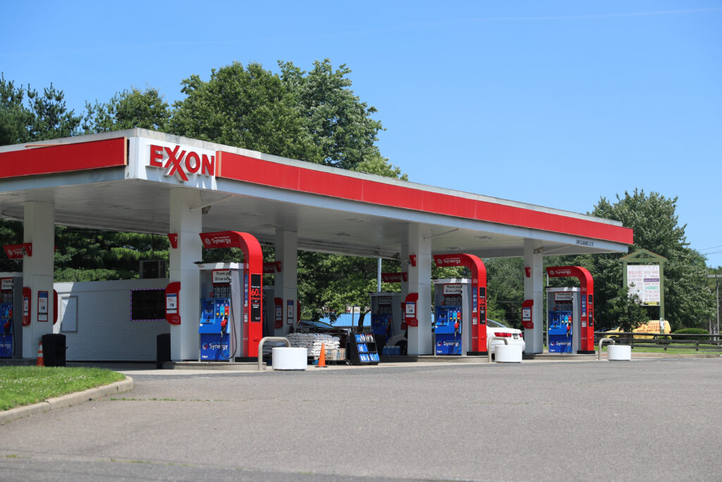 A gas station price sign in New Jersey showing elevated fuel prices