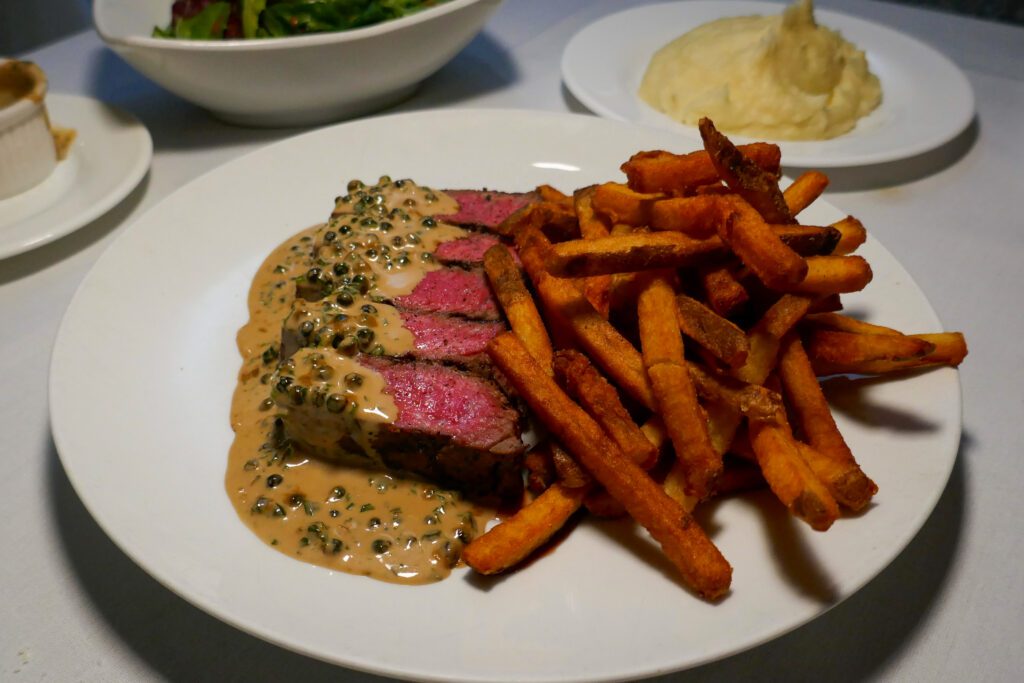 steak frites with au poivre sauce at laboratorio kitchen in montclair