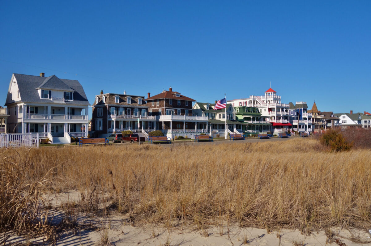 Victorian homes in Cape May New Jersey in front of a dune looking over the beach