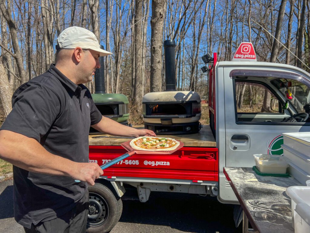 Culo Grosso's mobile pizza truck firing Neapolitan pies at an event in New Jersey