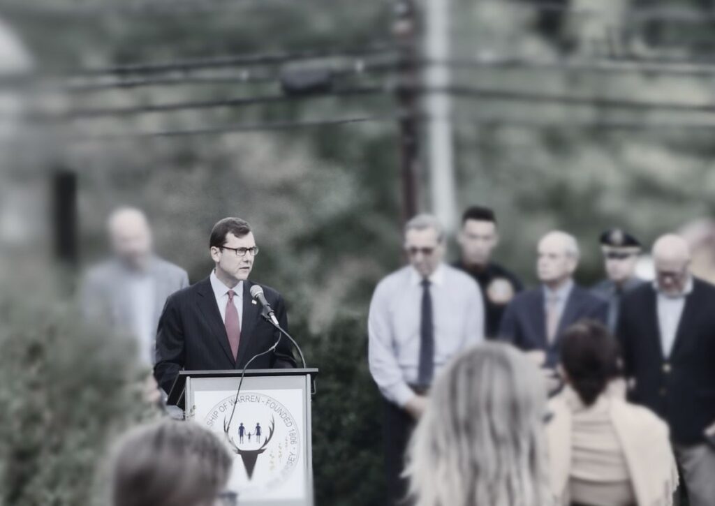 Rep. Tom Kean Jr. speaking at a podium at a public event in New Jersey