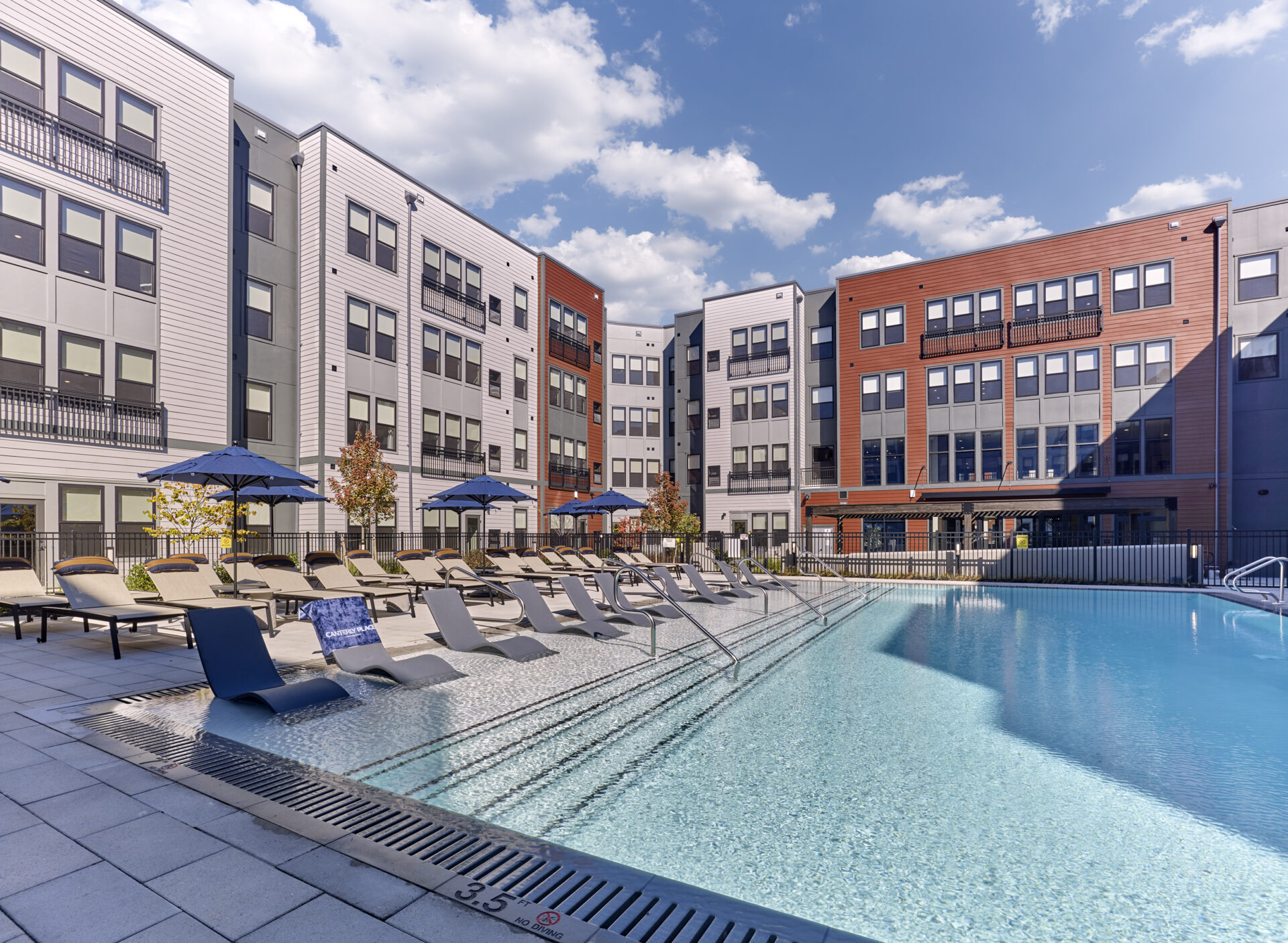 resort style pool and lounge chairs at Canterly Place luxury apartment complex in Livingston, NJ
